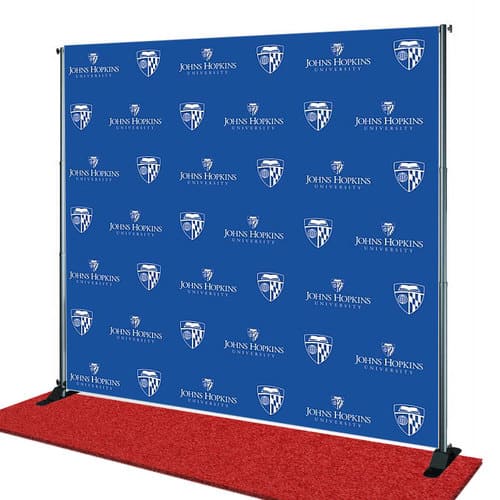 Step and repeat banner with Johns Hopkins University logo on a blue background