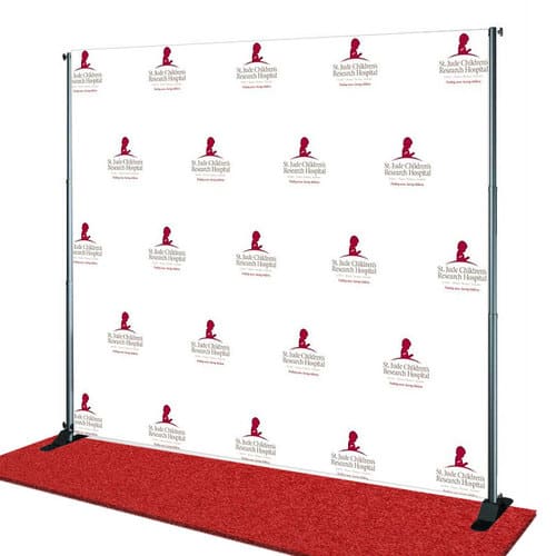 Step and repeat banner with St. Jude Children's Research Hospital logo on a red carpet